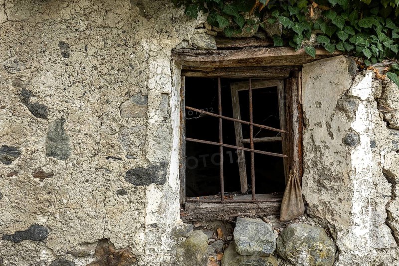 Dilapidated window of an old house in the mountain village of Bordei, Centovalli, Canton Ticino, Switzerland, Europe