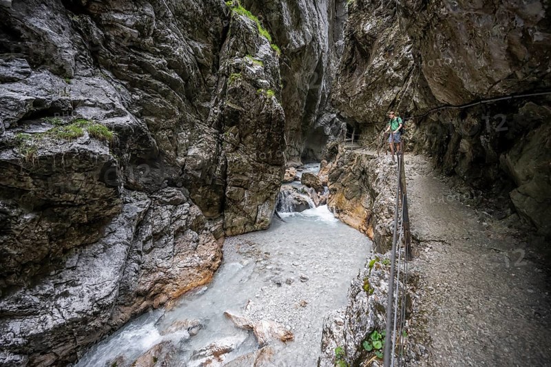 Hammersbach mountain stream in a canyon, mountaineer on a hiking trail in a gorge, Höllentalklamm, Höllental, Bavaria, Germany, Europe