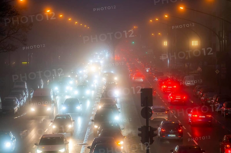 Dense fog, with visibility sometimes less than 100 metres, city centre traffic at rush hour on Alfredstraße, B224, in Essen, North Rhine-Westphalia, Germany, Europe