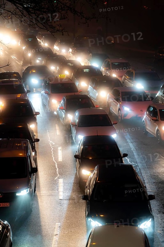 Dense fog, with visibility sometimes less than 100 metres, city centre traffic during rush hour at Haumannplatz, tributary to the B224, in Essen, North Rhine-Westphalia, Germany, Europe