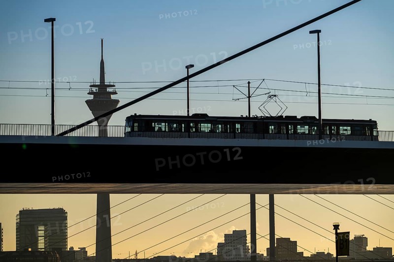 Tram on the Oberkassler Rhine Bridge, Rhine Tower, behind the Rheinknie Bridge, Düsseldorf, North Rhine-Westphalia, Germany, Europe