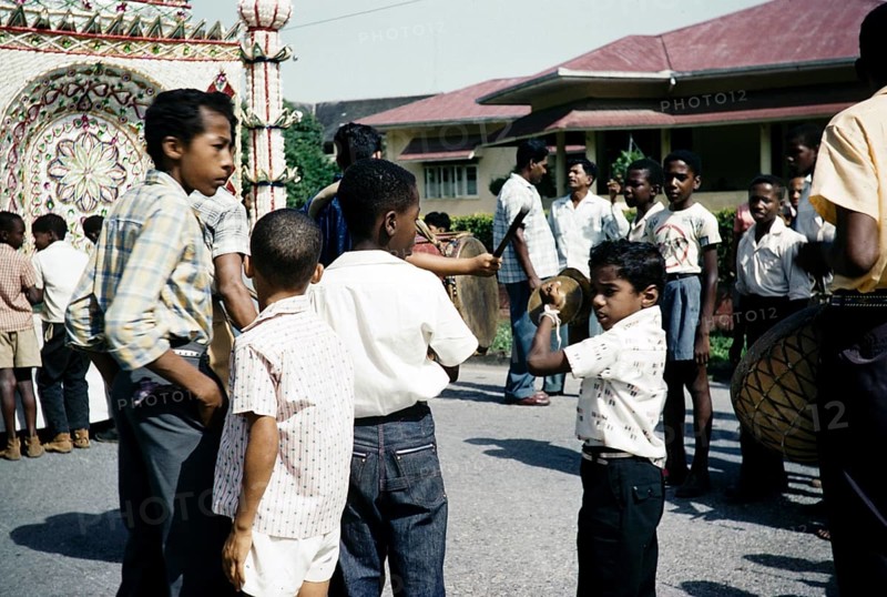 Hosay celebration, also Husayn or Hussein, Shia Muslim remembrance of Muharram, drumming and procession of tadjah floats model mausoleums or Mosque shaped model tombs, Trinidad 1961