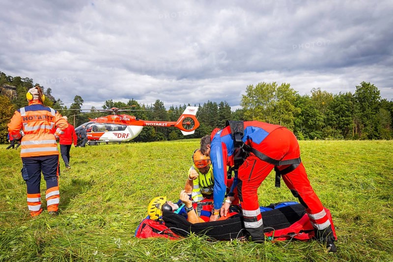 Winch rescue training of the rescue helicopter, Christoph 62, on the occasion of the 50th anniversary of the DRF Luftrettung. The rescue of casualties in the Elbe Sandstone Mountains will be practised