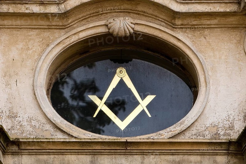 Close-up with compass and angle, two of the best-known symbols of Freemasonry on the lodge house, Hildesheim, Lower Saxony, Germany, Europe