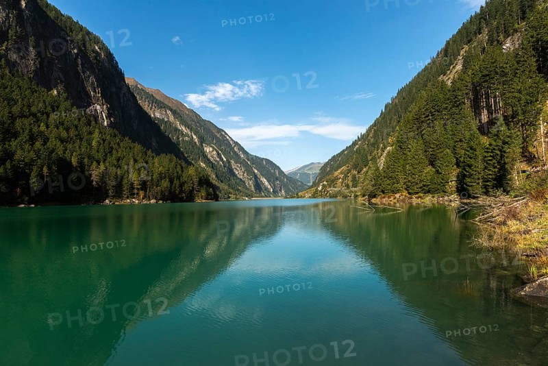 Stilluptal, Stiillup reservoir (1116m), Stillupgrund, Mayrhofen, reservoir lake, alpine mountain landscape, coniferous forest, water reflection, blue sky, symmetry, Zillertal Alps, Tyrol, Austria, Europe