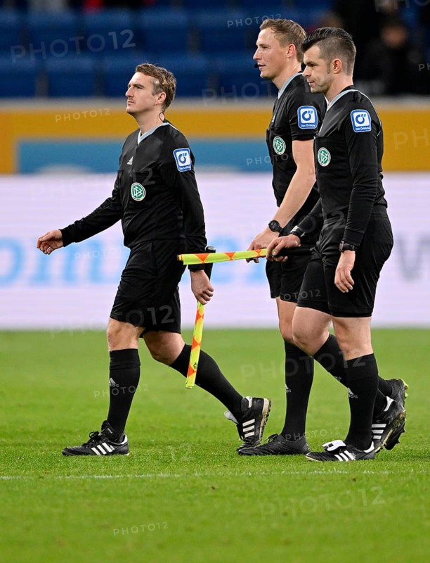 After the end of the match: Referee team around referee Martin Petersen (centre) and assistants Alexander Sather as well as Robert Wessel leave the field, PreZero Arena, Sinsheim, Baden-Württemberg, Germany, Europe