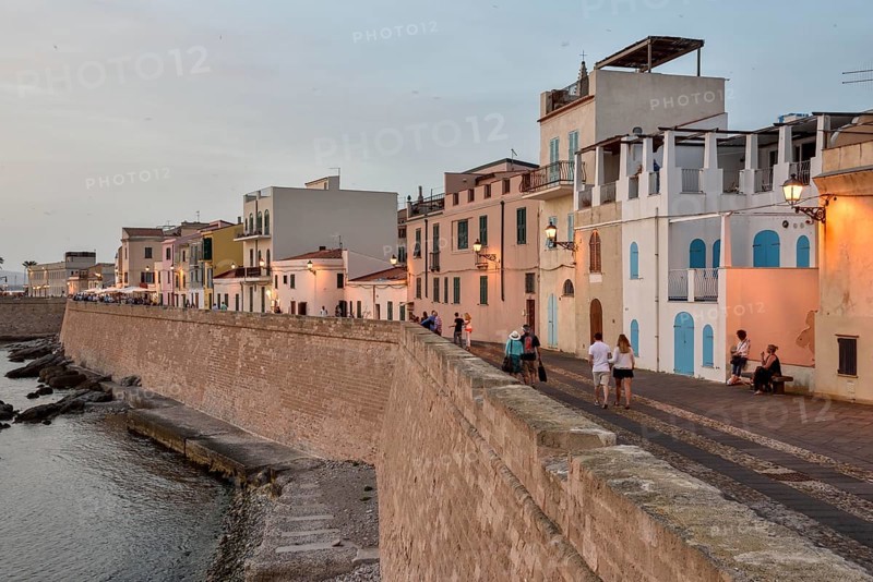 Row of houses above city wall, evening light, Alghero, Sassari Province, Sardinia, Italy, Europe