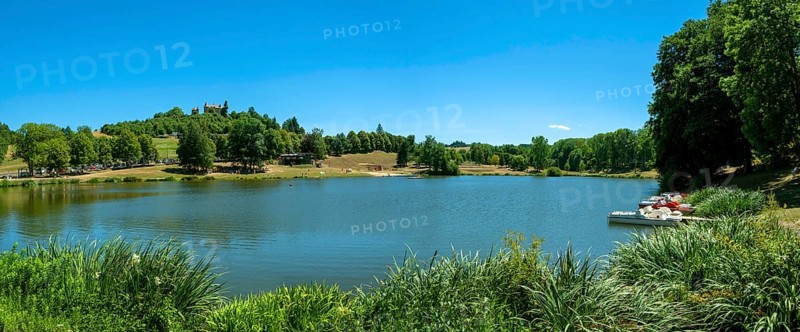 The castle of Montfort overlooking the lake of Vernet la Varenne. Puy de Dome department. Auvergne Rhone Alpes. France
