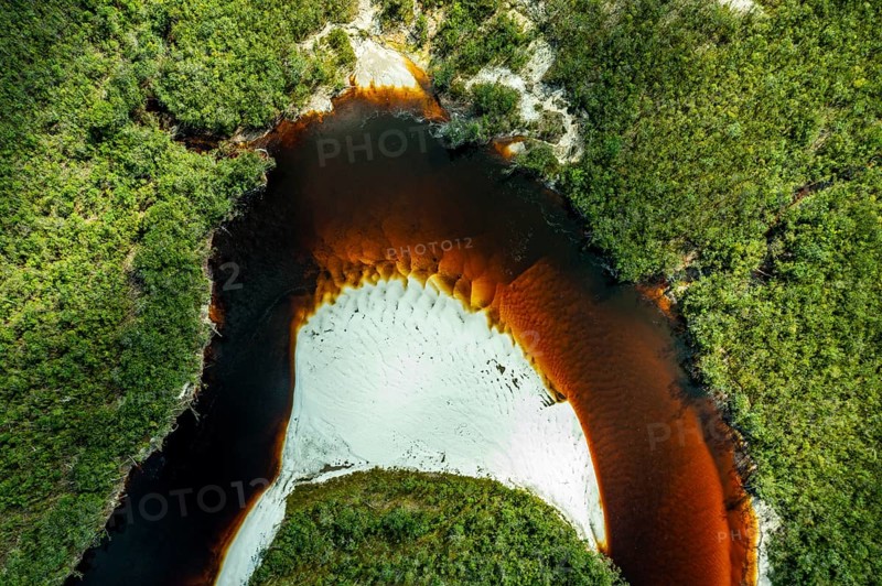 Black river and white sand beach before the granite hills, Cerros de Mavecure, Eastern Colombia