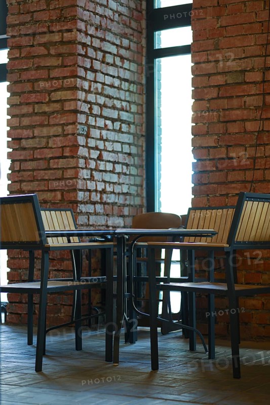 Small table with chairs around it in grunge bar