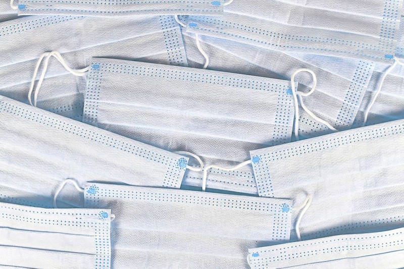White protective disposable medical face masks background
