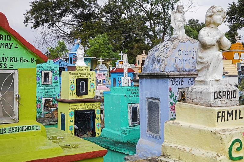 Colourful memorials, gravestones and tombstones at Hoctún Cemetery near Mérida, Yucatán, Mexico, Central America