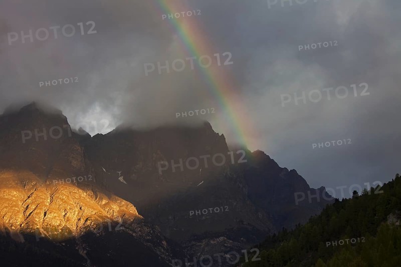 Rainbow over the mountains at Val Mingèr, Swiss National Park at Graubünden, Grisons in the Alps, Switzerland, Europe