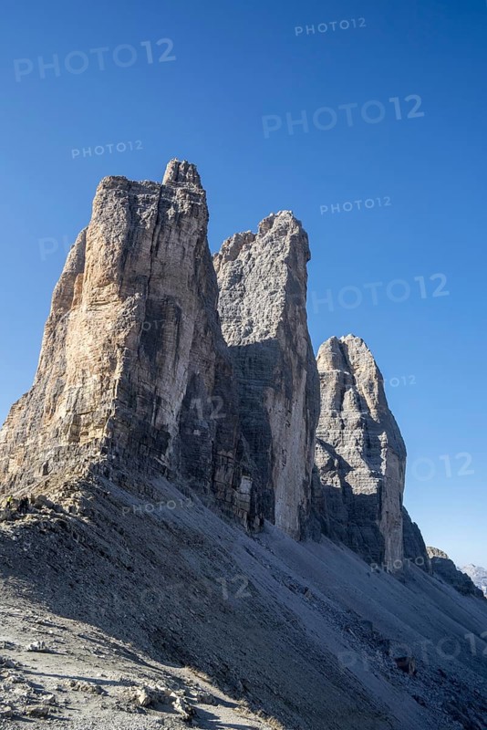North face of the Tre Cime di Lavaredo, Drei Zinnen, three distinctive mountain peaks at sunrise in the Sesto, Sexten Dolomites, South Tyrol, Italy, Europe