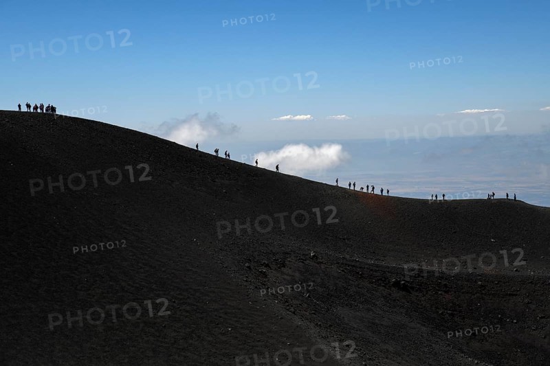 Hikers in the crater landscape of the volcano Etna, summit region, province of Catania, Sicily, Italy, Europe