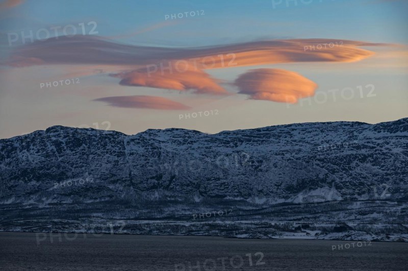 Lenticular clouds, Altocumulus lenticularis in winter in Norway, twilight, pink