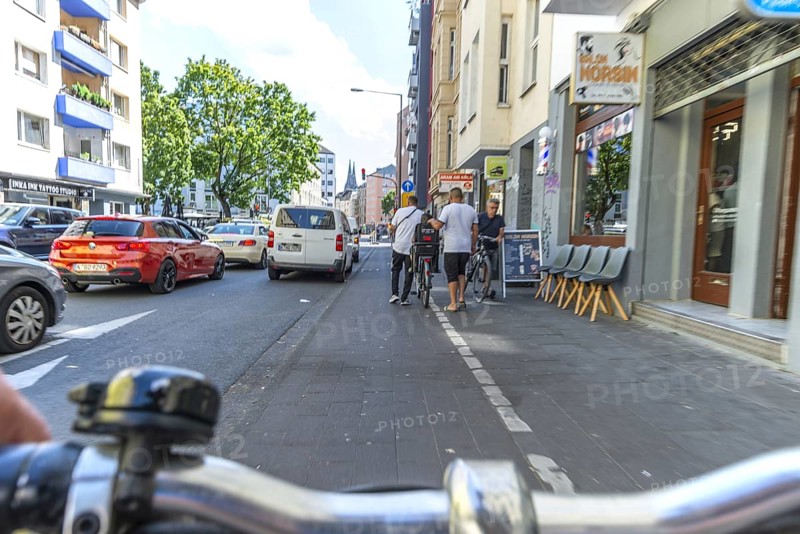 Cycling from a first-person perspective on a cycle path in Cologne, North Rhine-Westphalia, Germany, Europe