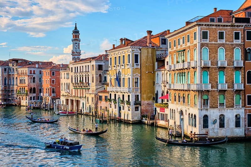 VENICE, ITALY, JUNE 27, 2018: Grand Canal with boats and gondolas on sunset, Venice, Italy, Europe