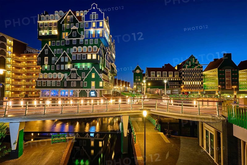 ZAANDAM, NETHERLANDS, MAY 8, 2017: Inntel Hotel in Zaandam illuminated at night. Design of 12-storey tall building opened in 2009 is the result of stacking a series of traditional Dutch houses