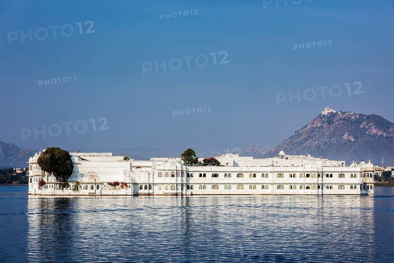 UDAIPUR, INDIA, NOVEMBER 23, 2012: Lake Palace (Jag Niwas) in Lake Pichola, Udaipur, Rajasthan. Lake Palace is a famous luxury hotel and has been voted as the most romantic hotel in India and in the world. Was featured in James Bond film Octopussy as the home of titular character