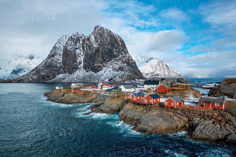 Hamnoy fishing village with red rorbu houses in Norwegian fjord in winter. Lofoten Islands, Norway, Europe