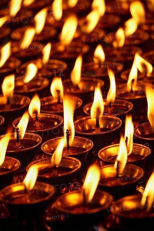 Burning candles in Buddhist temple. Dharamsala, Himachal Pradesh, India, Asia