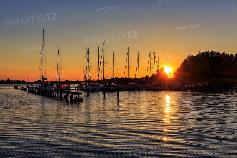 Sailing boats at sunset, waterway rest area, backlight, Wustrow harbour, Saaler Bodden, Fischland, Baltic Sea, Germany, Europe