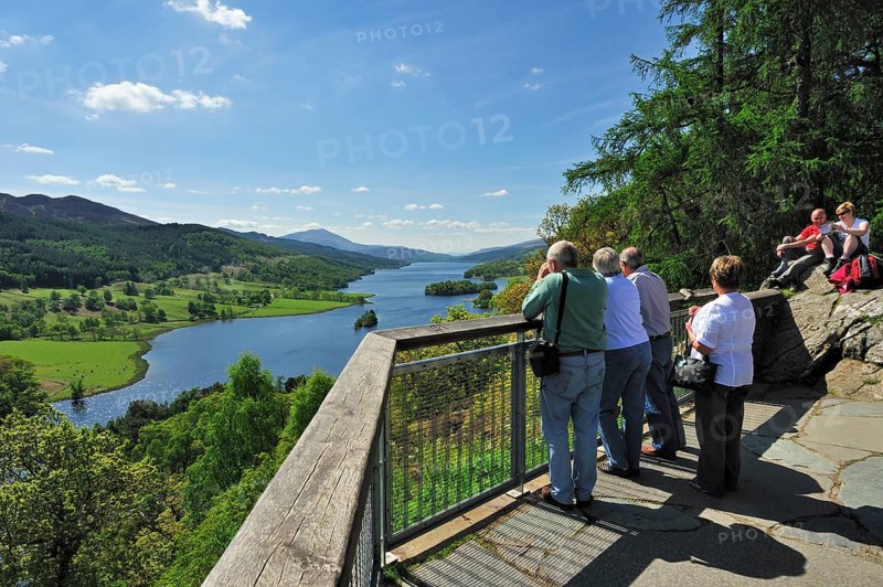 Tourists looking over Loch Tummel from Queens 's View near Pitlochry in Perth and Kinross, Scotland, UK