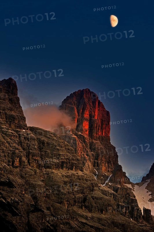 Alpine glow at sunset over Monte Cristallo mountain in the Dolomites, Italy, Europe
