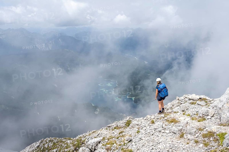 Mountaineer on the Waxenstein with fog, Wetterstein Mountains, Garmisch-Patenkirchen, Bavaria, Germany, Europe
