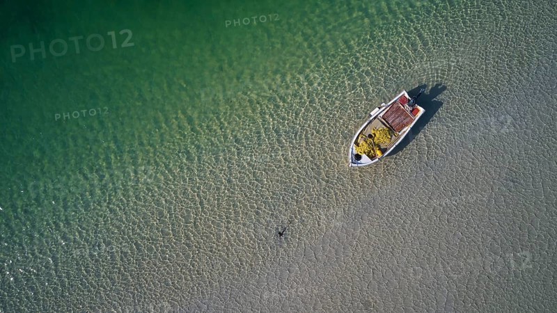 Drone shot, green lagoon, fishing boat directly from above, Gramvoussa peninsula, Pirate Bay, Balos, Tigani, West Crete, island of Crete, Greece, Europe