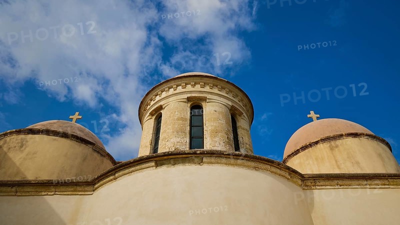 Towers with cross, round tower, ochre building, wide angle, blue sky with white clouds, Odigitrias monastery, east coast of Rodopou peninsula, western Crete, island of Crete, Greece, Europe