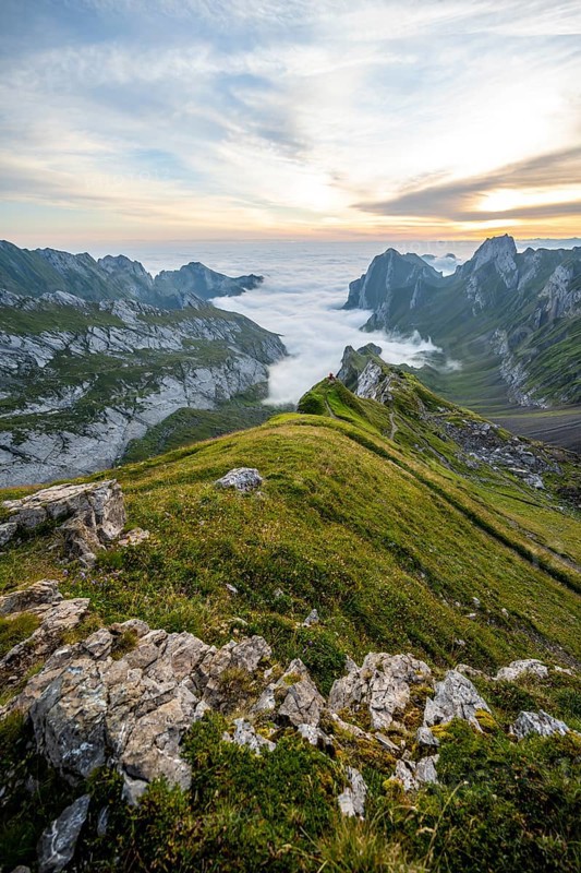 View over Säntis mountains into the valley of Meglisalp at sunrise, Rotsteinpass, high fog in the valley, Säntis, Appenzell Ausserrhoden, Appenzell Alps, Switzerland, Europe