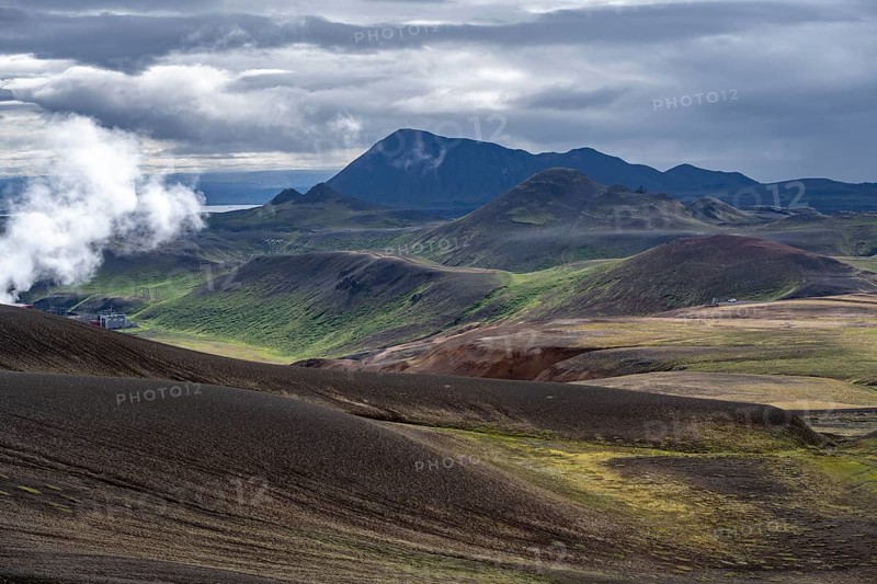 Volcanic landscape with colourful hills, steam of the Krafla geothermal power plant, geothermal area, Northern Iceland, Iceland, Europe