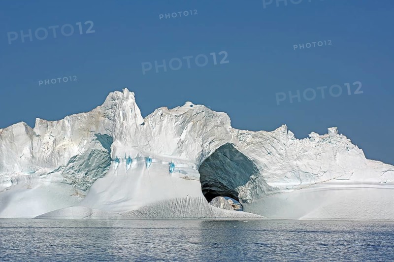 Iceberg with large ice cave, Ilulissat, Disko Bay, Denmark, Greenland, North America