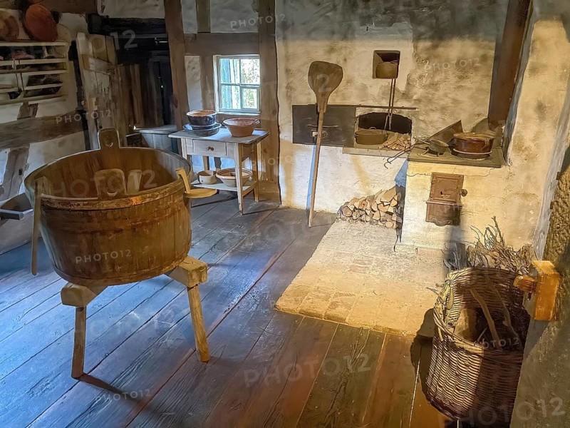 View into historical kitchen left old washing tub wooden tub back recessed in wall oven for baking bread for baking bread in old rebuilt restored small farmhouse weaver's house half-timbered house in open-air museum Neuhausen, Neuhausen ob Eck, district of Tuttlingen, Baden-Württemberg, Germany, Europe