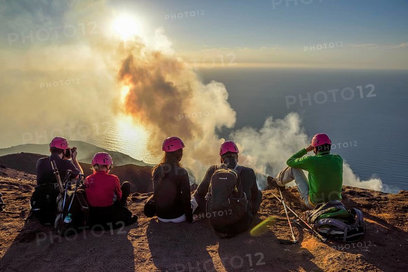 Tourists at the crater edge of the smoking layer volcano Stromboli, island Stromboli, Liparian Islands, Italy, Europe