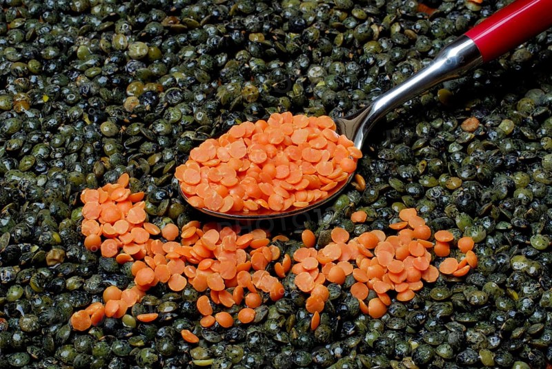 Green and red Lentils (Lens culinaris) with spoon