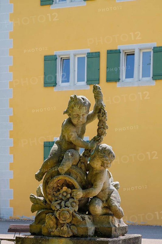 Putti, putti, group of putti in the castle garden, sculpture, stone sculpture, naked child figure, behind Grafeneck Castle, former hunting lodge of the Dukes of Württemberg around 1560, later summer residence of Duke Carl Eugen von Württemberg, Grafeneck killing centre during the Third Reich, today home for the disabled of the Samaritan Foundation and memorial, documentation centre, historical building, architecture, Gomadingen-Grafeneck, Swabian Alb, Baden-Württemberg, Germany, Europe
