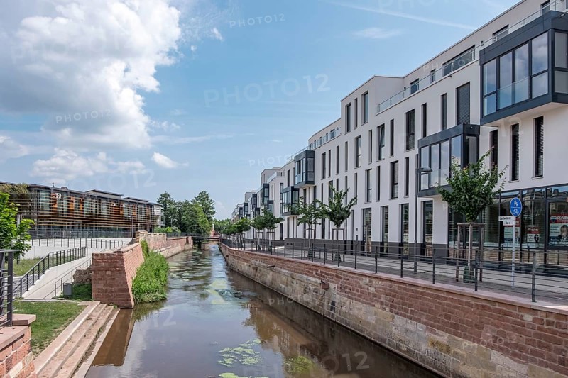 New residential buildings by the river Queich, on the left the municipal library on the former slaughterhouse site, Landau, Palatinate, Rhineland-Palatinate, Germany, Europe