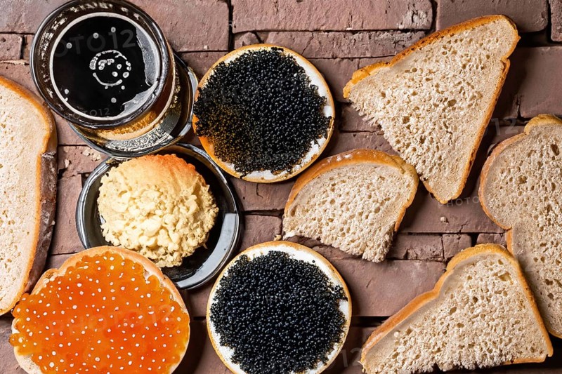 Different kinds of caviar with bread and beverages, AI generated