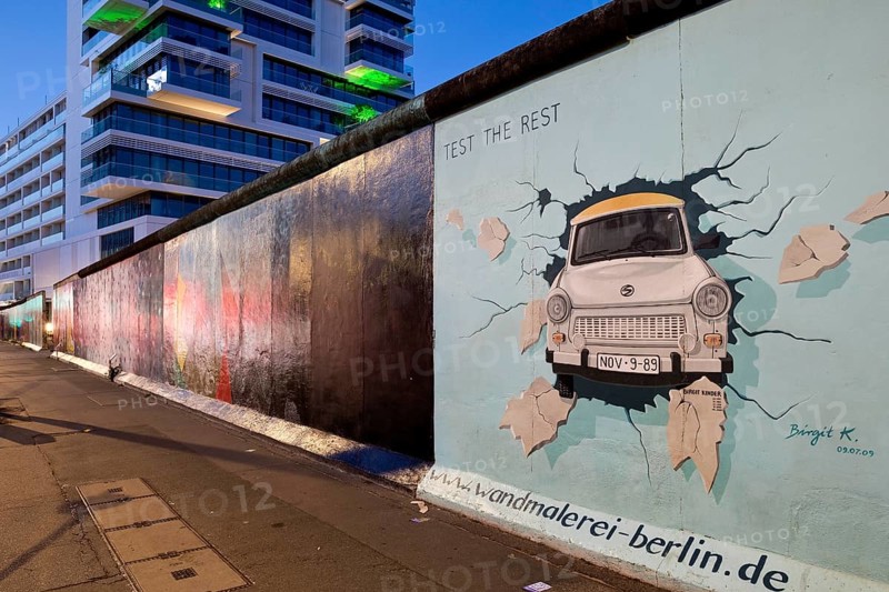 Mural on the rest of the Berlin Wall with the cardiac stress test (Test The Rest), Trabi durchbricht Mauer, artist Birgit Kinder, East Side Gallery, Berlin, Germany, Europe