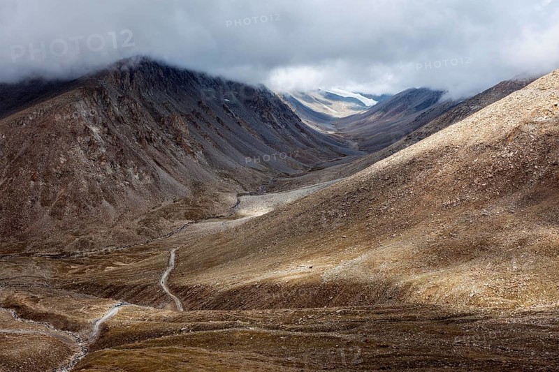 Himalayan landscape with road near Kunzum La pass, allegedly the highest motorable pass in the world (5602 m)