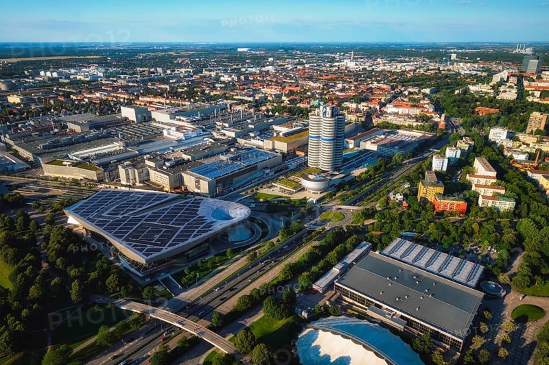 MUNICH, GERMANY, JULY 08, 2018: Aerial view of BMW Museum and BWM Welt and factory and Munich from Olympic Tower. BMW is a famous German luxury car automaker