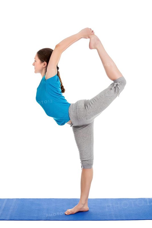 Yoga, young beautiful slender woman yoga instructor doing Lord of the Dance Pose (Natarajasana) asana in ashtanga vinyasa style exercise isolated on white background