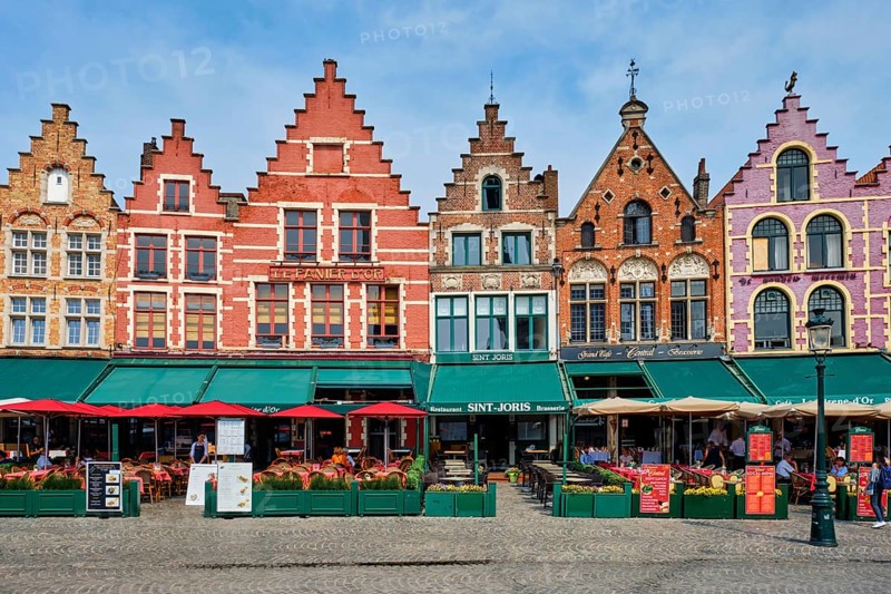 Bruges, Belgium, May 29, 2018: Bruges Grote markt square famous tourist place with many cafe and restaurants, Europe
