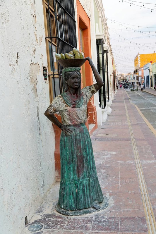 Sculpture statue of Mayan woman carrying bowl of fruit on her head, Campeche city, Campeche State, Mexico, Central America