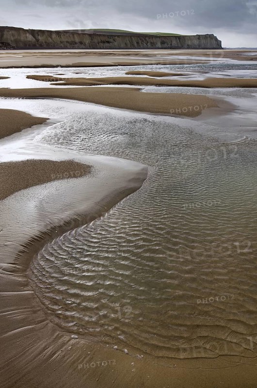 Tide pools on sand beach at low tide at Cap Blanc Nez, Pas-de-Calais, France, Europe