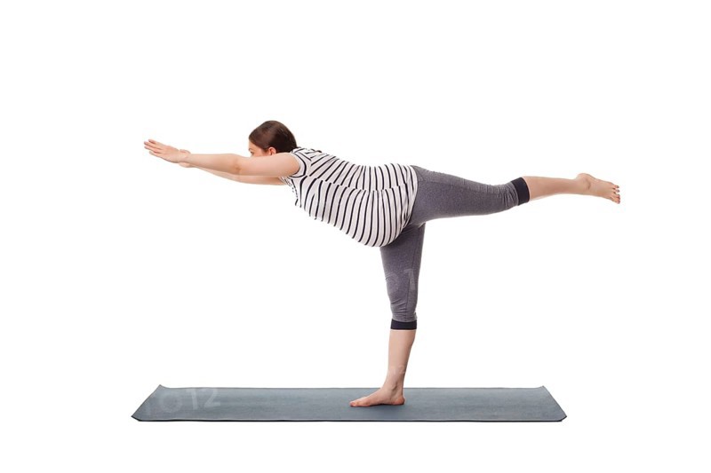 Pregnancy yoga exercise, pregnant woman doing asana virabhadrasana 3, warrior pose isolated on white background