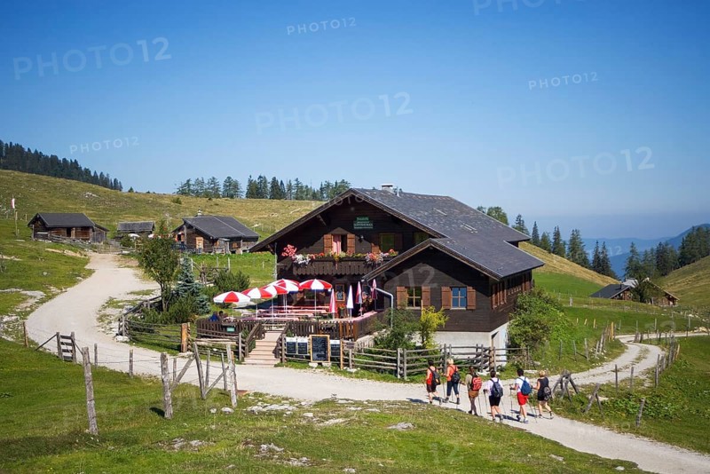 Alpine huts, hikers in front of the Schafbergblick snack station on the Postalm, Osterhorn group, Salzkammergut, Salzburg province, Austria, Europe